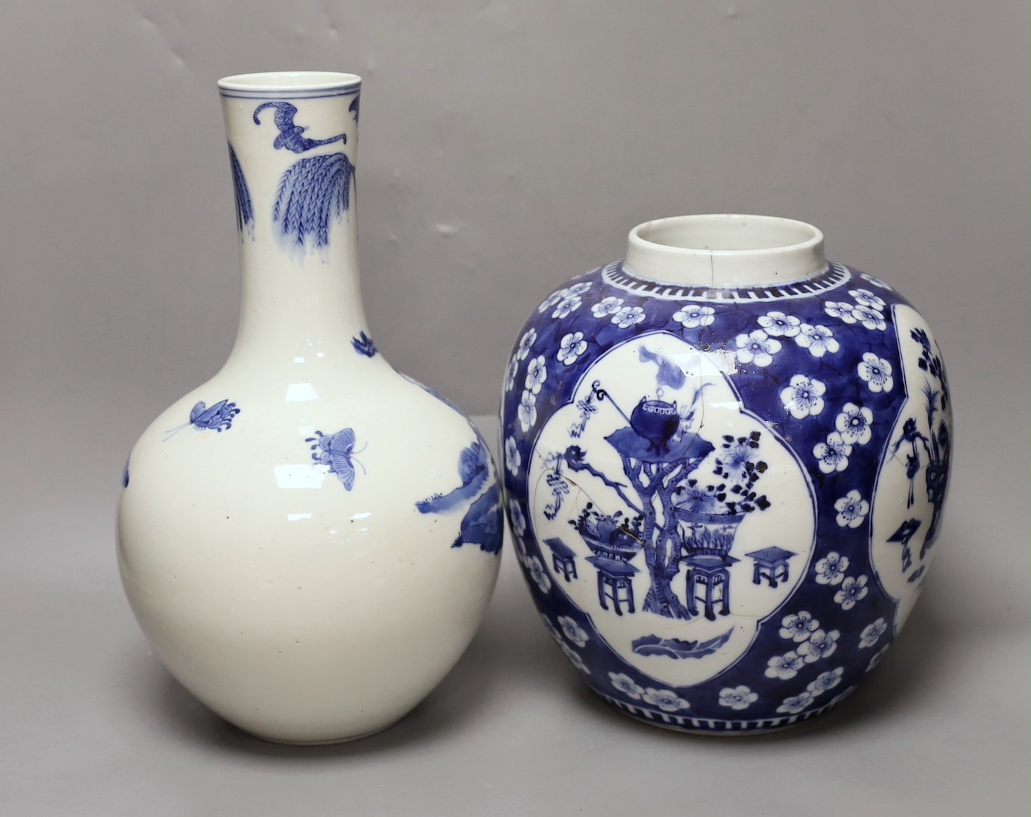 A Chinese blue and white ‘Antiques’ jar, early 20th century and a Chinese blue and white bottle vase, tallest 35cm